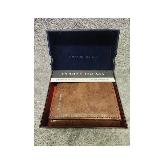 Tommy Hilfiger men's brown leather RFID trifold wallet, model 31HP110044, in its presentation box